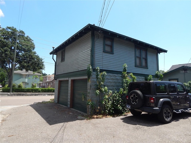 view of side of property featuring a garage