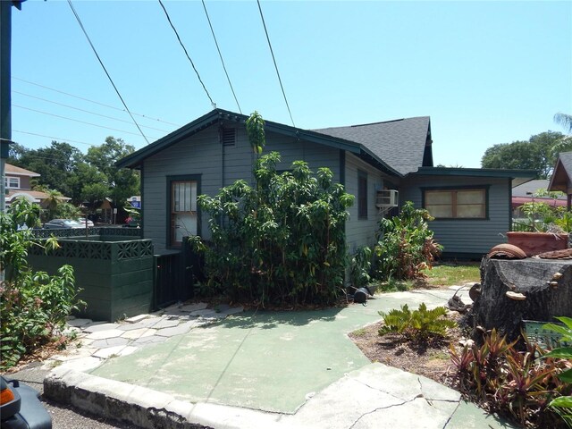 view of front of property with cooling unit and a patio