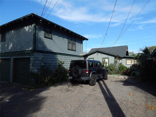 view of side of property featuring a garage