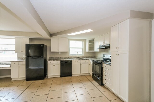 kitchen with black appliances, sink, and white cabinetry