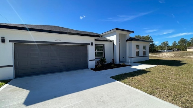 view of home's exterior featuring a garage and a yard