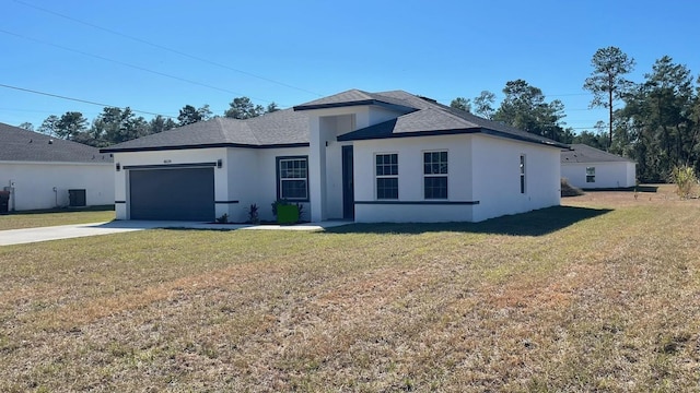 view of front of house featuring a garage, a front lawn, and central air condition unit