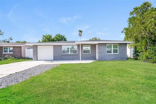 single story home featuring a garage and a front yard