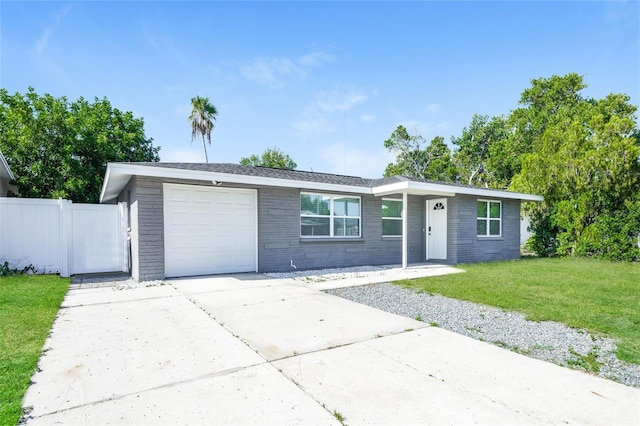 ranch-style house with a garage and a front yard