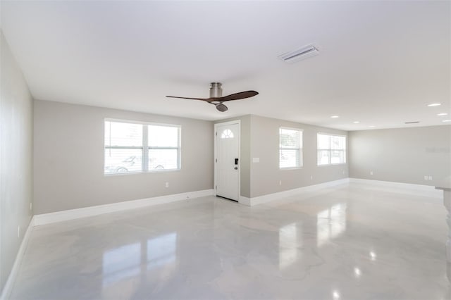 empty room with a healthy amount of sunlight and ceiling fan