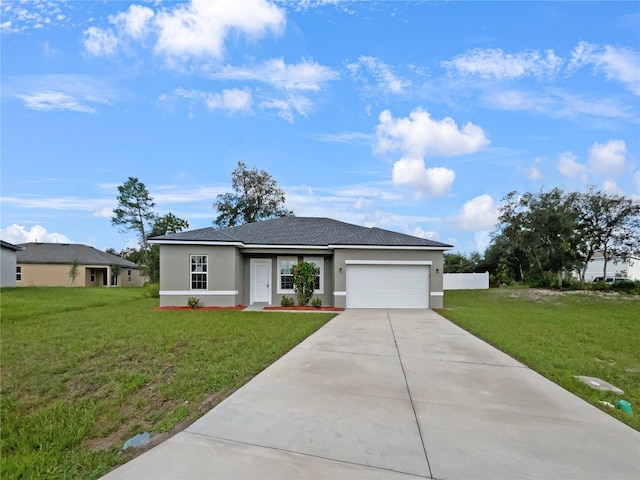 view of front of home with a garage and a front yard