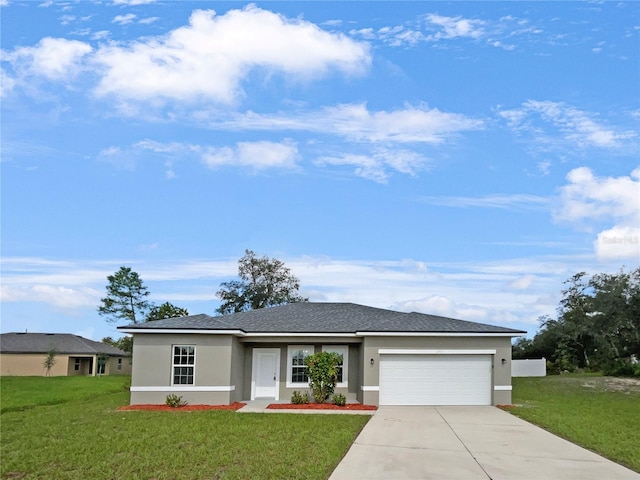 view of front of home with a garage and a front yard