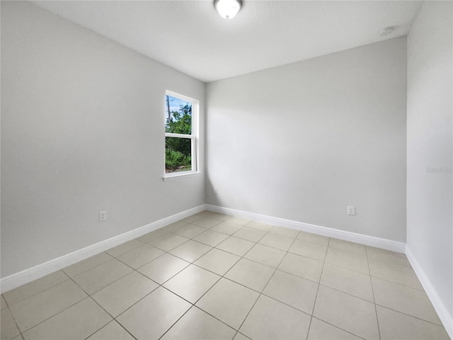 spare room with light tile patterned floors