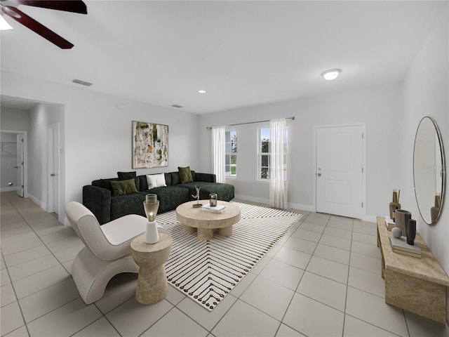 living room featuring light tile patterned flooring and ceiling fan