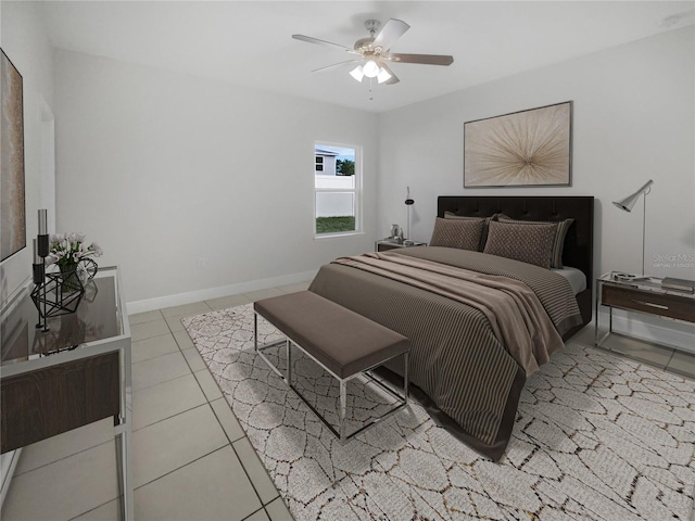 tiled bedroom featuring ceiling fan