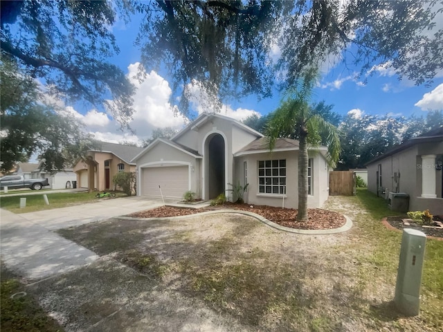 single story home featuring a garage