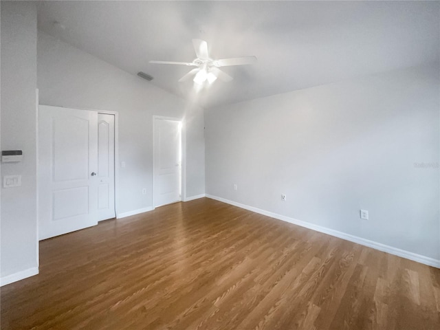 interior space featuring dark hardwood / wood-style flooring, ceiling fan, and lofted ceiling