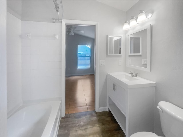 full bathroom with hardwood / wood-style floors, bathtub / shower combination, toilet, ceiling fan, and vanity