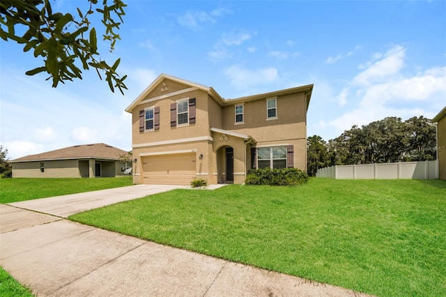 front of property featuring a garage and a front lawn