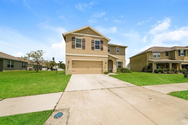 view of property featuring a garage and a front lawn