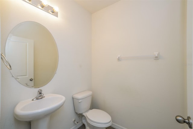 bathroom with toilet and sink