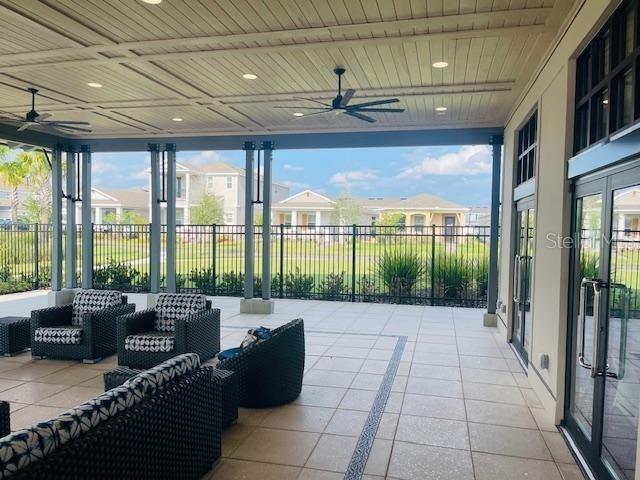 view of patio with ceiling fan and outdoor lounge area