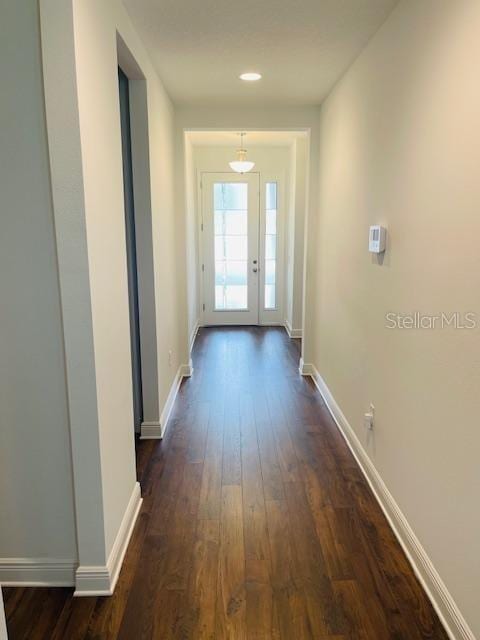 doorway to outside featuring dark hardwood / wood-style floors