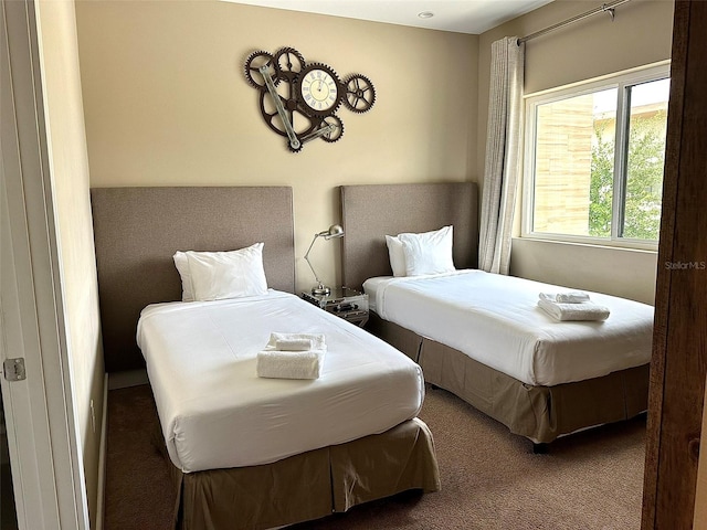 bedroom featuring dark colored carpet