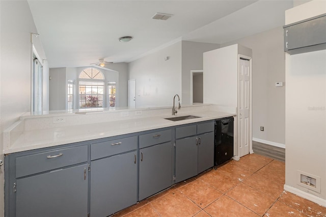 kitchen featuring ceiling fan, a sink, light countertops, gray cabinets, and dishwasher