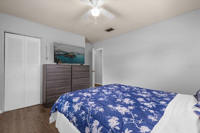 bedroom with a closet, ceiling fan, and dark hardwood / wood-style floors