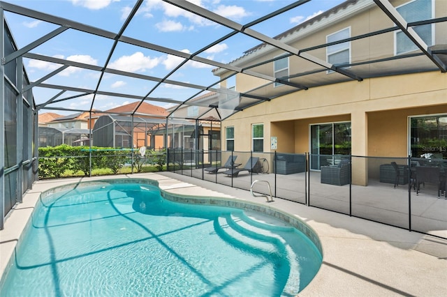 view of pool featuring a lanai and a patio