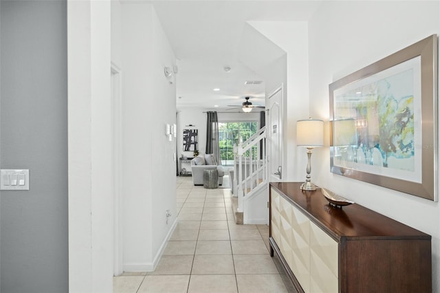hall featuring visible vents, light tile patterned flooring, baseboards, stairway, and recessed lighting