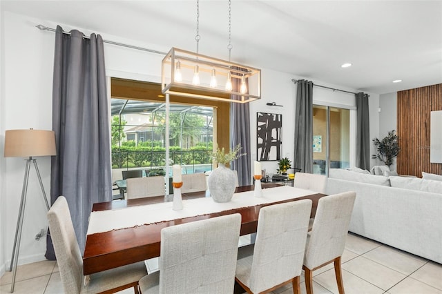dining area featuring light tile patterned floors and recessed lighting