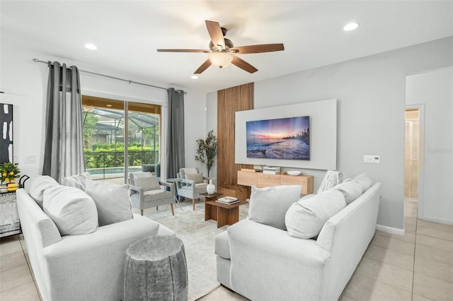 tiled living room featuring ceiling fan