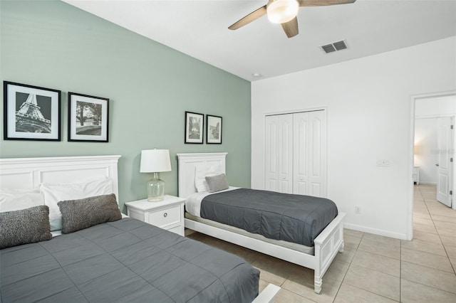 tiled bedroom featuring a closet and ceiling fan