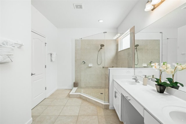 full bathroom with tile patterned flooring, double vanity, baseboards, a sink, and a stall shower
