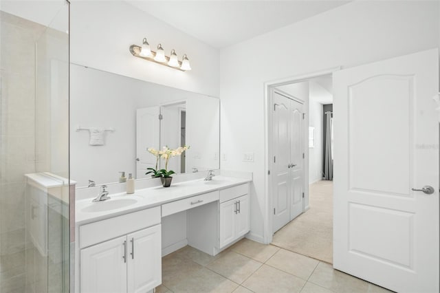 bathroom featuring tile patterned floors, walk in shower, and vanity