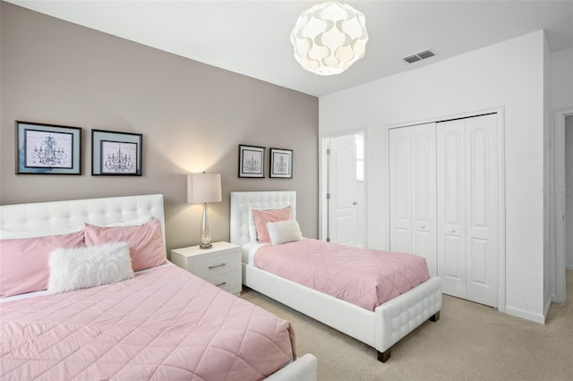 bedroom featuring light colored carpet, baseboards, visible vents, and a closet