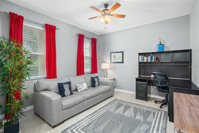 tiled office space featuring ceiling fan