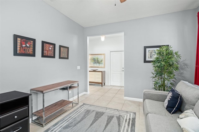 tiled living room with ceiling fan