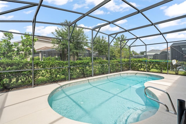 pool with a patio, a lanai, and a residential view