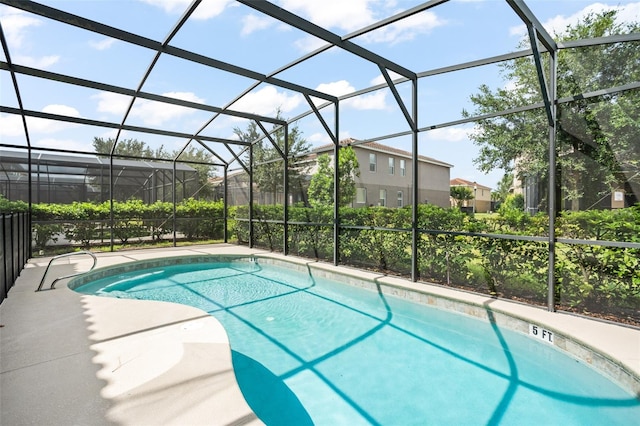 view of pool featuring a lanai and a patio area