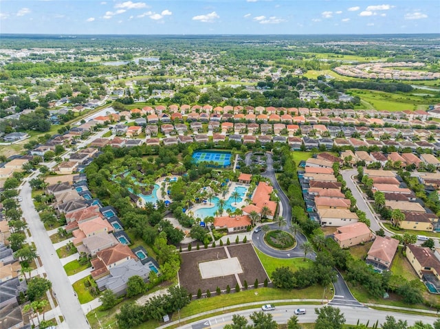 birds eye view of property with a residential view