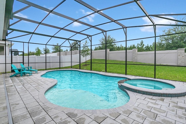 view of swimming pool featuring a patio area, glass enclosure, and an in ground hot tub