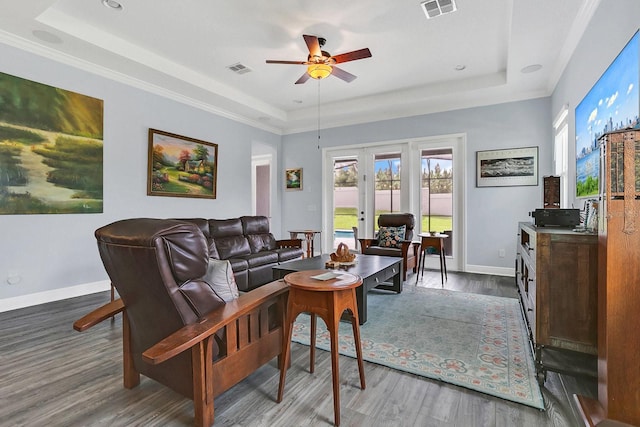 10472 Petrillo Way, Winter Garden, FL 34787 - living area featuring visible vents, a raised ceiling, a ceiling fan, and wood finished floors