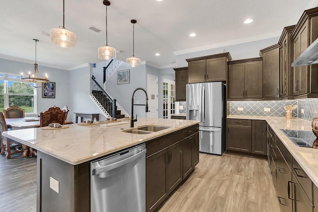 10472 Petrillo Way, Winter Garden, FL 34787 - kitchen featuring a sink, stainless steel appliances, visible vents, and light wood finished floors