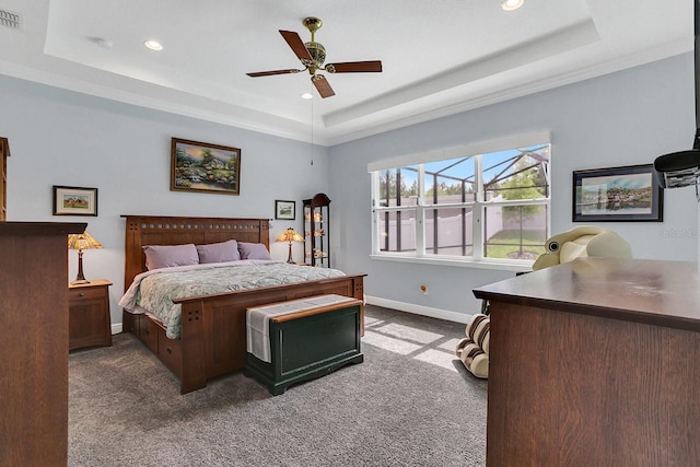 10472 Petrillo Way, Winter Garden, FL 34787 - carpeted bedroom featuring visible vents, a raised ceiling, baseboards, and ceiling fan