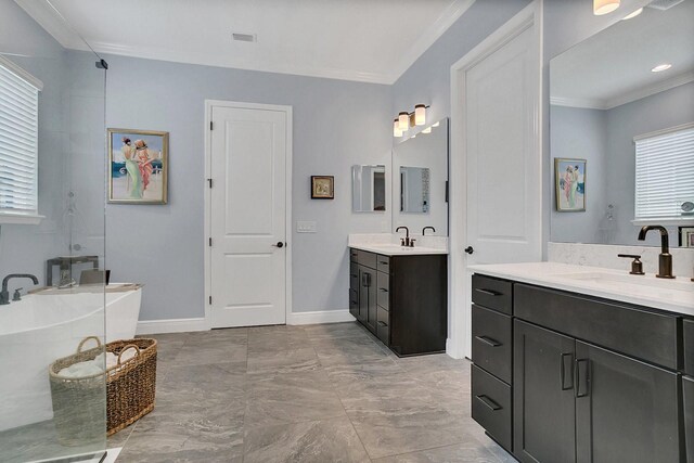 bathroom with plenty of natural light, vanity, and ornamental molding