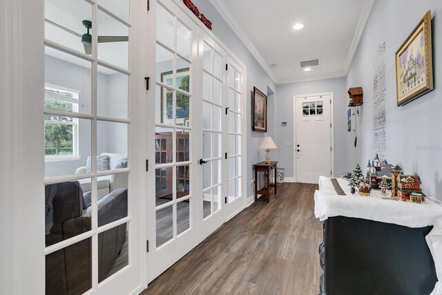 interior space with crown molding, french doors, and dark hardwood / wood-style flooring