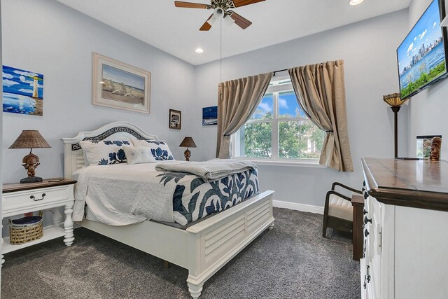 bedroom featuring dark carpet and ceiling fan