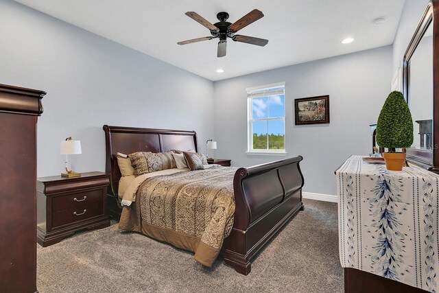 bedroom with light carpet and ceiling fan