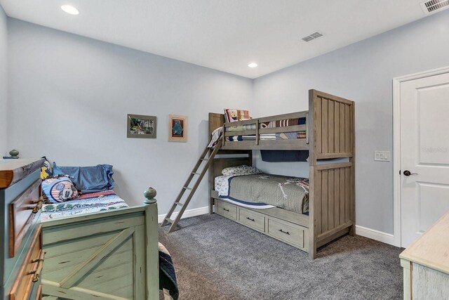 bedroom featuring dark colored carpet