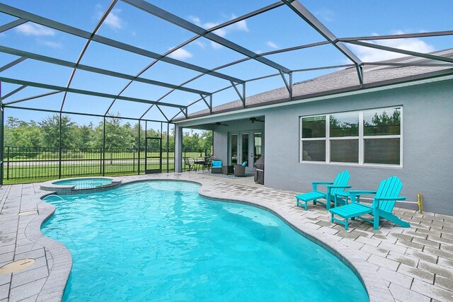 view of swimming pool featuring a lanai, a patio, ceiling fan, and an in ground hot tub