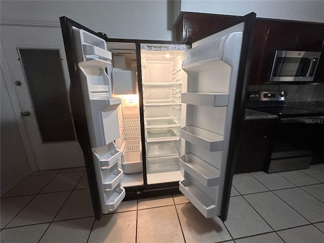 details featuring light tile patterned floors, electric range, and white fridge with ice dispenser