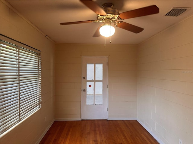 interior space featuring hardwood / wood-style floors and ceiling fan